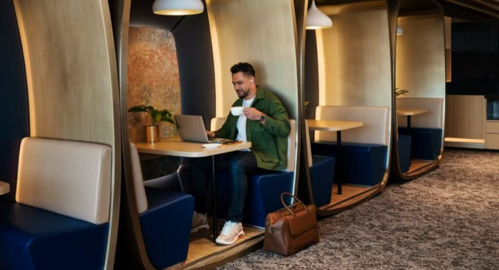 Man drinking coffee at the Chase Sapphire Lounge in Hong Kong.