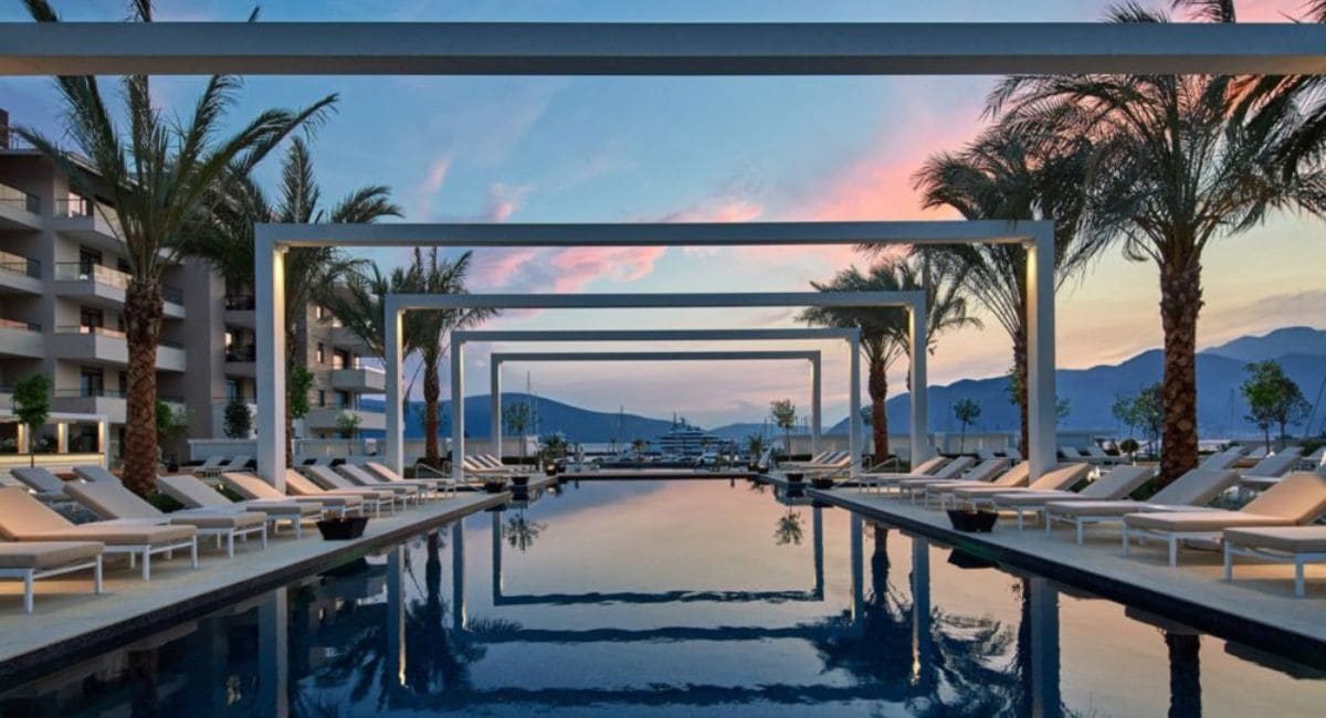 The Regent Porto Montenegro has comfortable lounge areas by the pool, providing breathtaking views of Lovćen Mountain and Boka Bay
